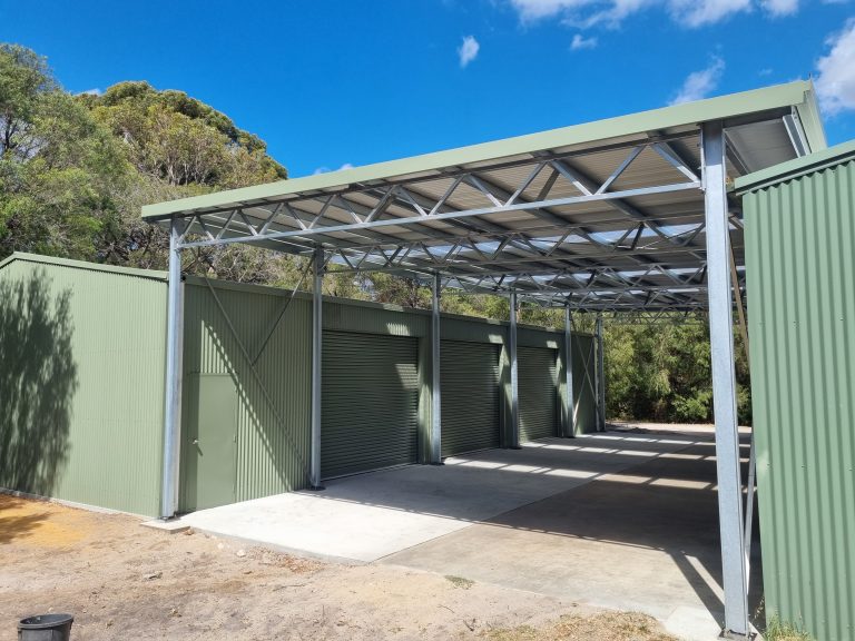 Completed green shed shelter for agricultural equipment