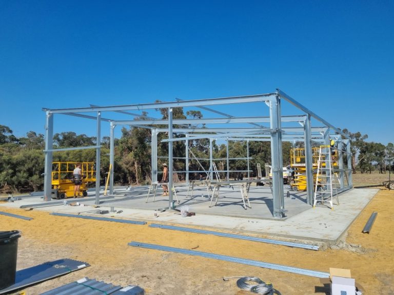 Shed under construction concrete foundation and steel frame